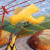 painting of yellow crop duster with meadowlark in foreground