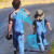 Painting of boys walking down country road with bug nets